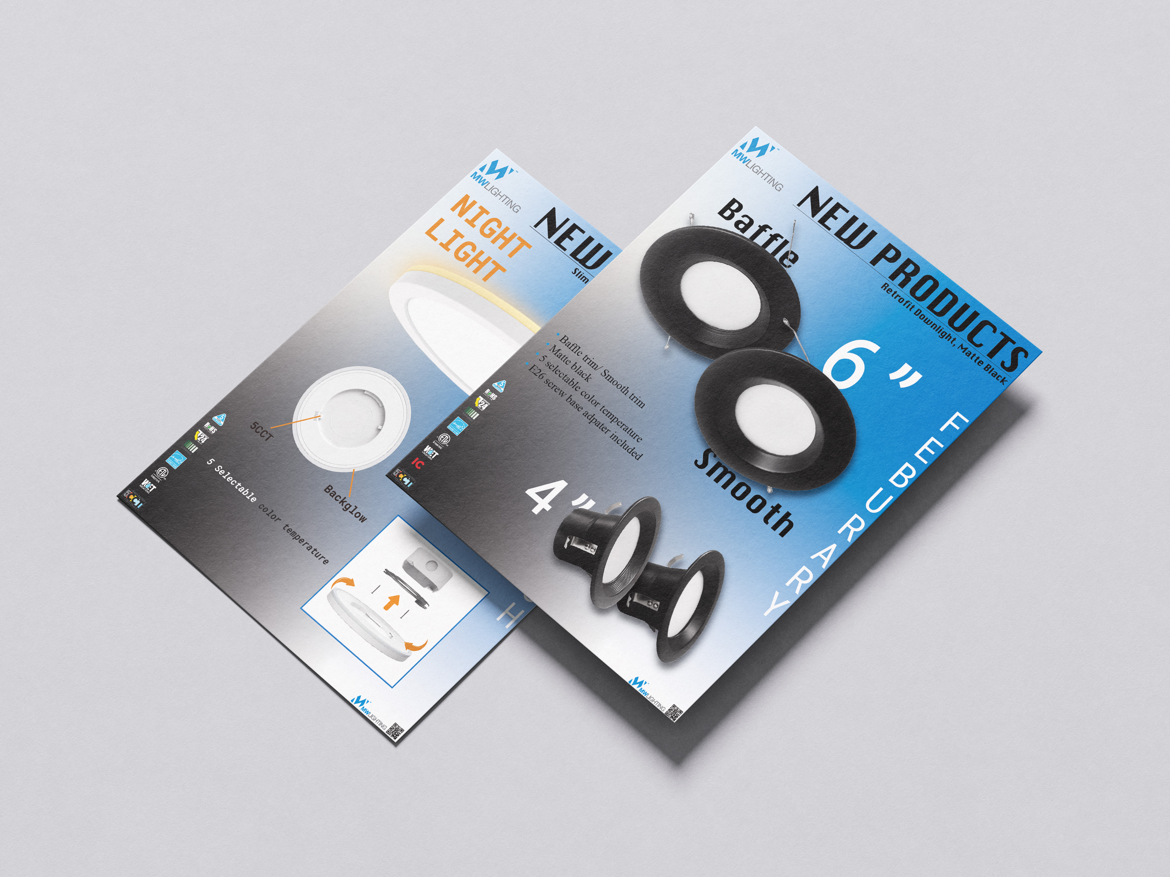 Printed mockup of two overlapping blue MW Lighting flyers: the Round Slim Surface Mount Night Light and the matte black Retrofit Downlight new products flyer